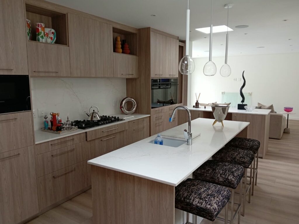 Kitchen cabinetry and pendant lights